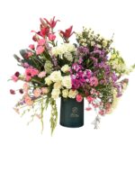 Lilium and the delicacy of Roses with enchanting wild touches of Trachelium and Amaranthus